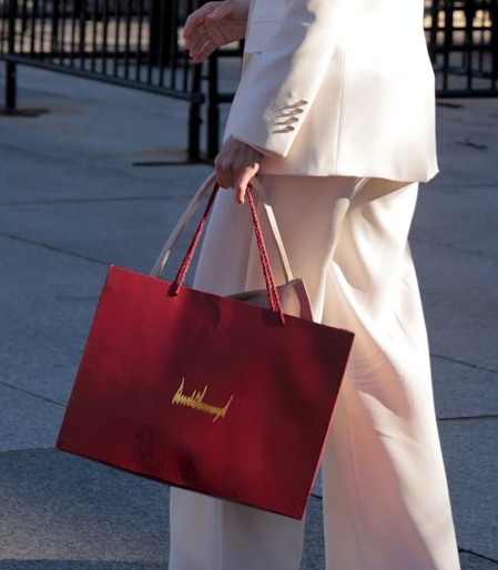 María Corina Machado with a red bag.